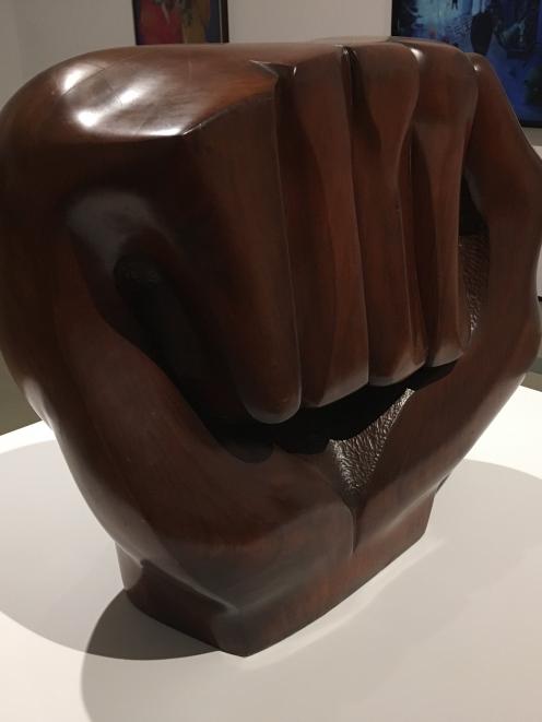 The raised fist of Elizabeth Catlett's 'Black Unity' sculpture symbolises resistance and...