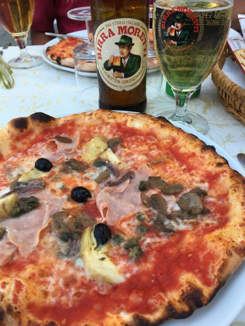 Pizza and a beer makes a perfect meal in Burano.