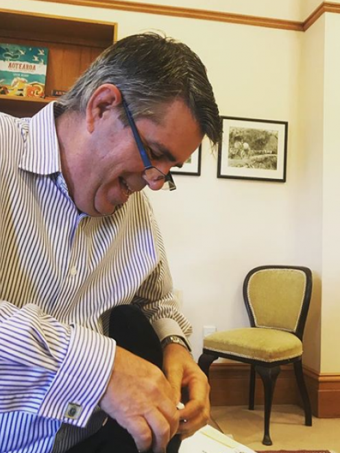 Jacinda Ardern posted this image of her father, Ross Ardern, helping her with her shoes a few...