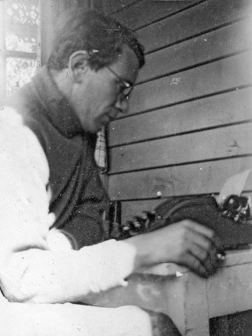 Curnow at his typewriter, intensely focused on his writing. He often worked late at The Press, and would get down to his poetry after he came home.  PHOTO: PRIVATELY HELD