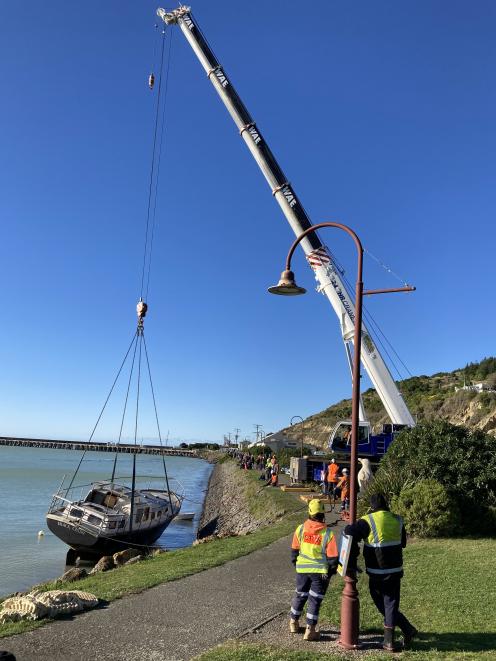 The Black Crow was retrieved from the water by a giant crane early this afternoon. Photo: Graham...
