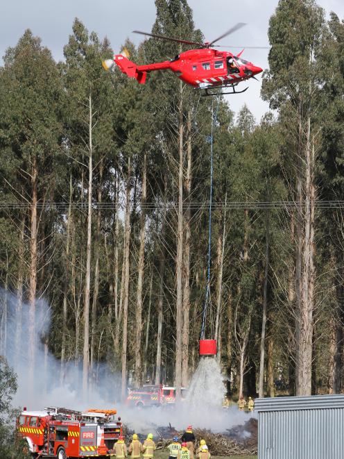 Two choppers were called to deal with the blaze. Photo: John Cosgrove