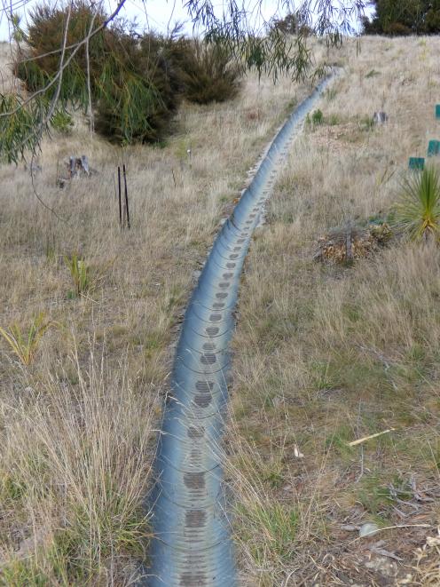 A corrugated iron channel  funnels stormwater runoff to Lake Hawea.PHOTO: SIMON HENDERSON
...