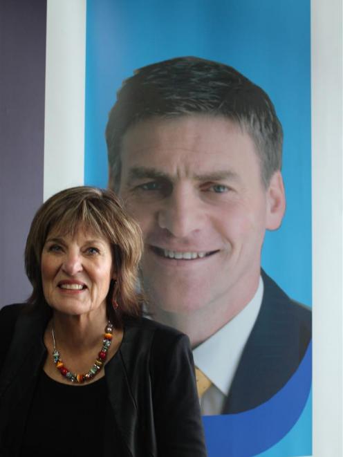 Former Gore electorate agent Glenys Dickson, in front of the Clutha/Southland electorate office featuring an image of its then MP, Bill English. Photo by Margaret Phillips.