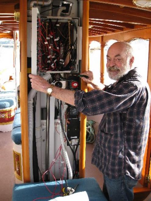 Former electronic engineer Terry Middleditch shows off some of the  electrics on the historic Otago Harbour ferry. Photo by Phillip de Wattignar