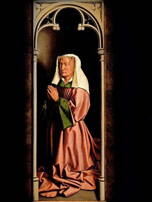 Elisabeth Borluut, who commissioned the altarpiece with her husband also appears. Photo: Getty...