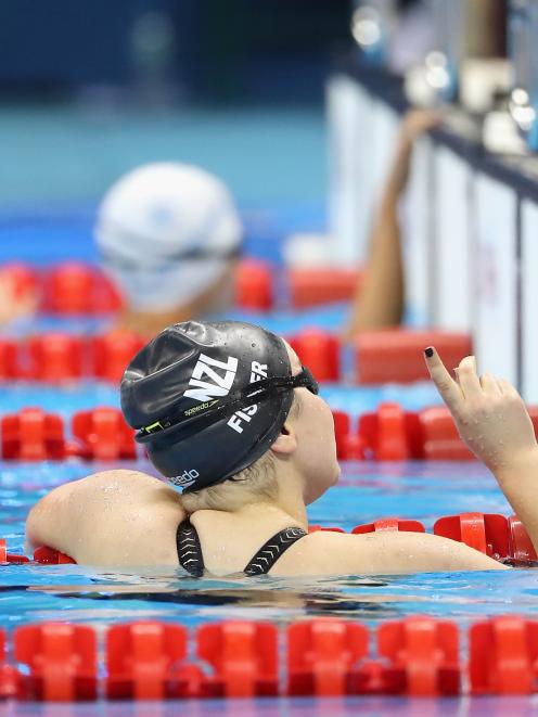 Fisher celebrates her victory at the Aquatic Centre. Photo: Getty Images 