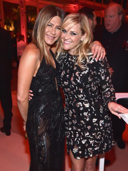Jennifer Aniston (left) with Reese Witherspoon at an Oscars party this year. Photo: Getty Images 