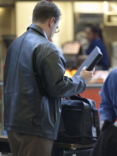 Passengers on some airlines won't be able to take laptops or other devices as part of carry on luggage. Photo: Getty Images 