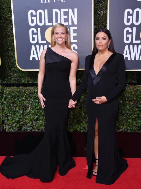 Actresses Reese Witherspoon (left) and Eva Longoria are among high-profile stars in the Time's Up...