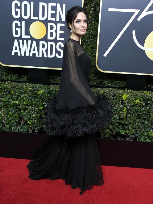 Angelina Jolie wore a stunning dress trimmed with feathers by Atelier Versace. Photo: Getty Images