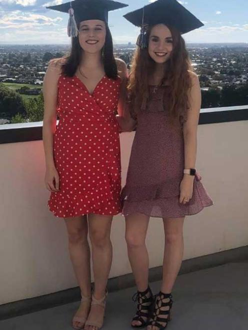 CELEBRATIONS: The lockdown blues didn't stop UC students Harriet Burke (left) and Katie Hollings...