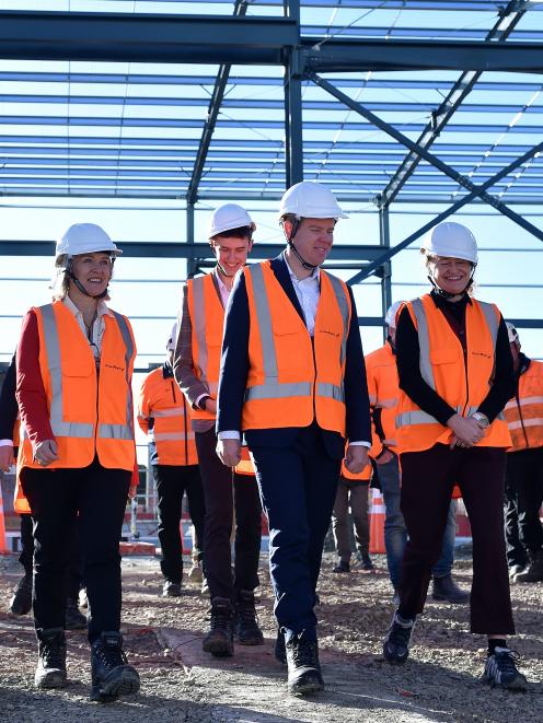 Labour figures in high-vis stride across the Hillside building site.