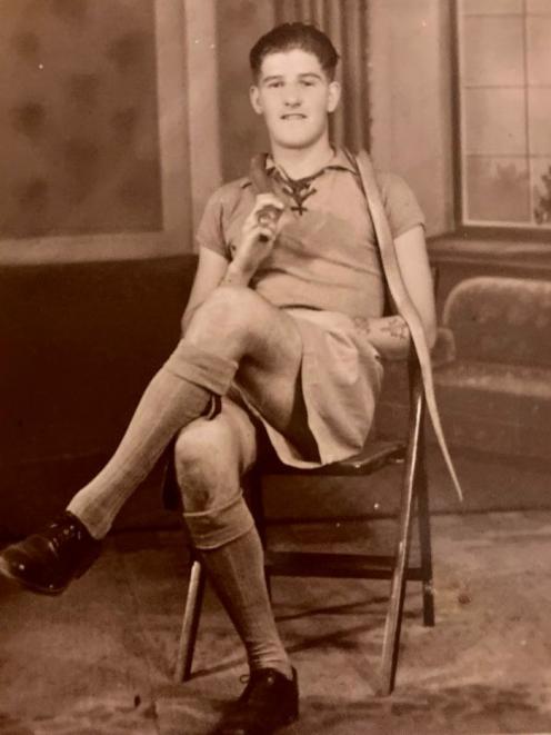 Private Jack Hassell photographed with a cobra snake during his posting to India with the Welch...