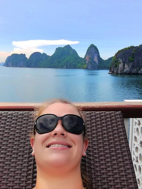 Lauren relaxing on her junk boat cruise in Halong Bay, Vietnam. PHOTO: LAUREN MACSHANE 

