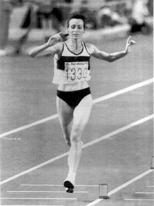Lorraine Moller crosses the finish line of the women's marathon in third place at the Barcelona...