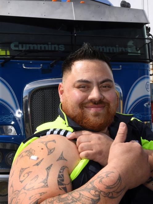 Mainfreight Dunedin operations manager Jason Waho gives a thumbs-up after having his Covid jab....