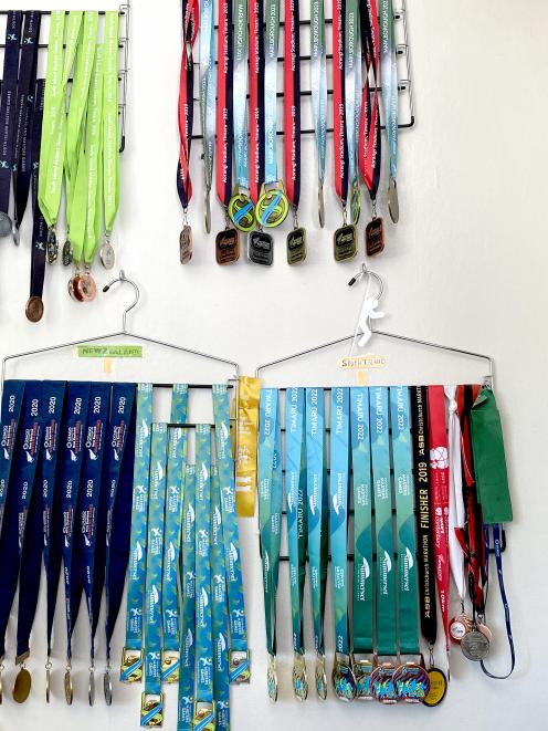 John’s many medals from the New Zealand Masters Games. Photo: Supplied