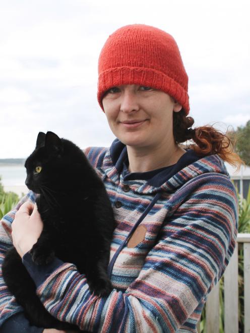 Cat-lover Nico Jarvis with her neighbour’s 8-year-old cat, Nhabuz Fishaw. Photo: ODT files 