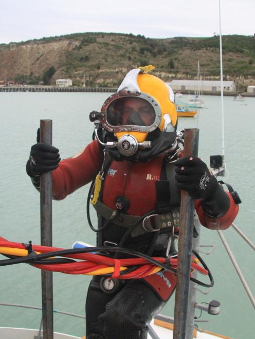 Bays Underwater Services diver Luke Wright heads below the deck to inspect the deterioration of...
