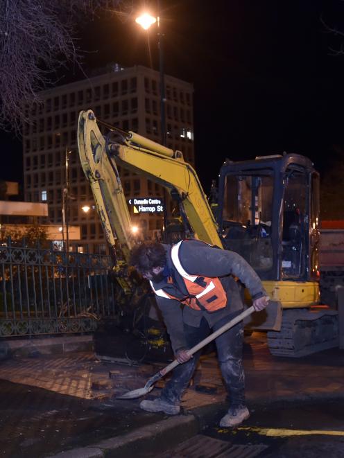 Daniel Lamb, of QC Contracting, lifts paving stones in upper Stuart St in Dunedin on Monday. ...