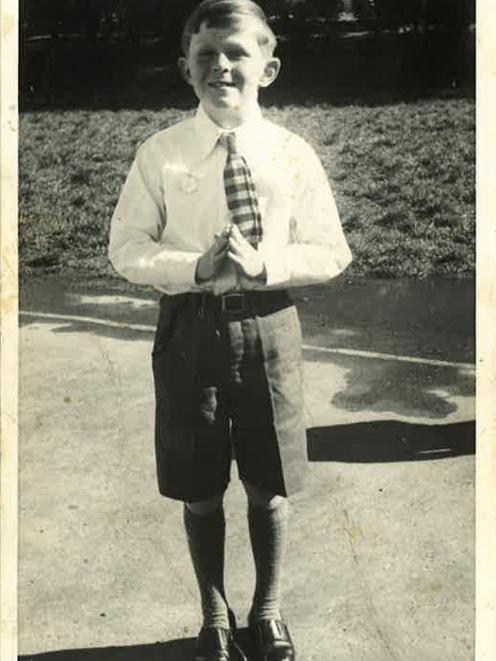 In 1961, wearing his Sunday best, Mark Henaghan prepares to take his first communion at the...