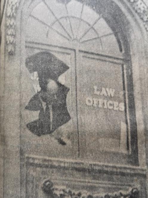 Detective Segeant E. R, Tyson examines the window that was shattered by the blast in Mr J. P Ward...