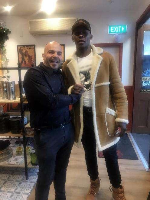 Mixed martial artist Israel Adesanya (right) with Pedro’s by the Lake owner Damian Brown in...
