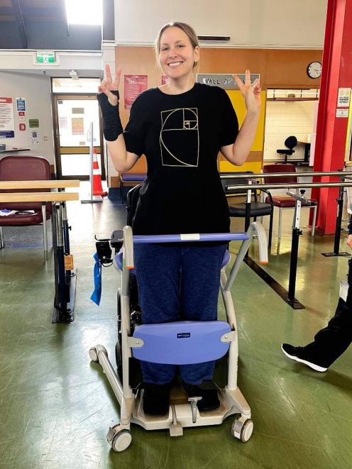 Rachel Jordan taking some of her first steps, three months after the helicopter crash. Photo:...