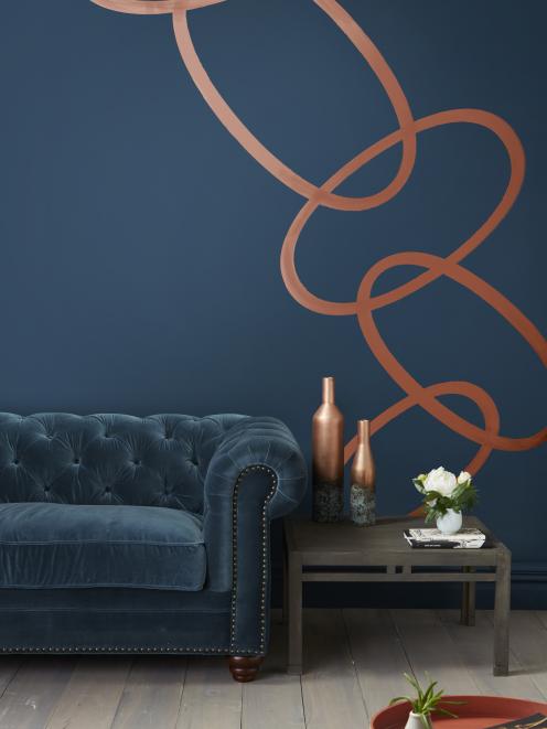 A stormy blue wall in Resene Tangaroa, with Resene Copper Fire, Resene Colorwood Tiri, and Resene...