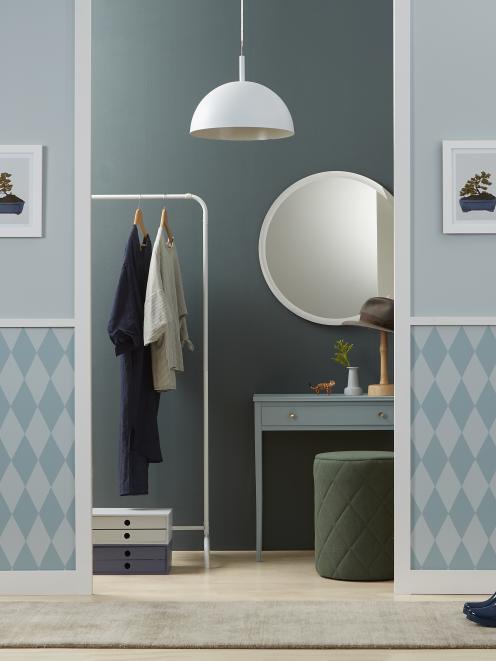 The dark inner wall (in Resene Dark Slate) of this serene dressing-room brings depth to the small...