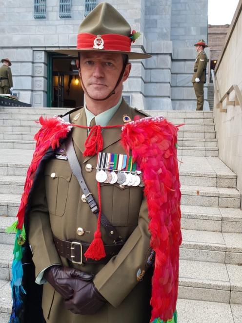 Warrant Officer Class One Robert Jobe wearing the cloak he wove. Photo: RNZ