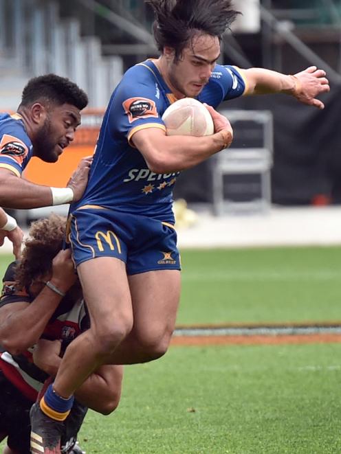 Otago centre Josh Timu tries to get away from Counties-Manukau midfield back Orbyn Leger....