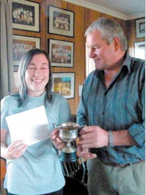 Rebecca Ryan (17) is presented with the Dawson trophy for her Waikaka team winning the A reserve...