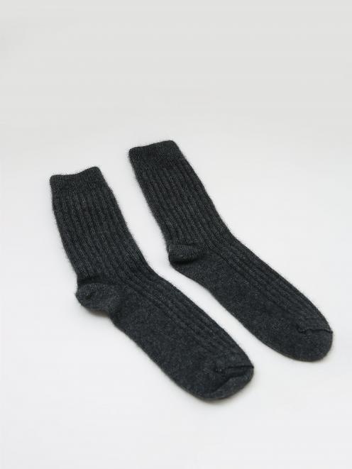 Moochi goes for a hand-knitted snuggle sock.