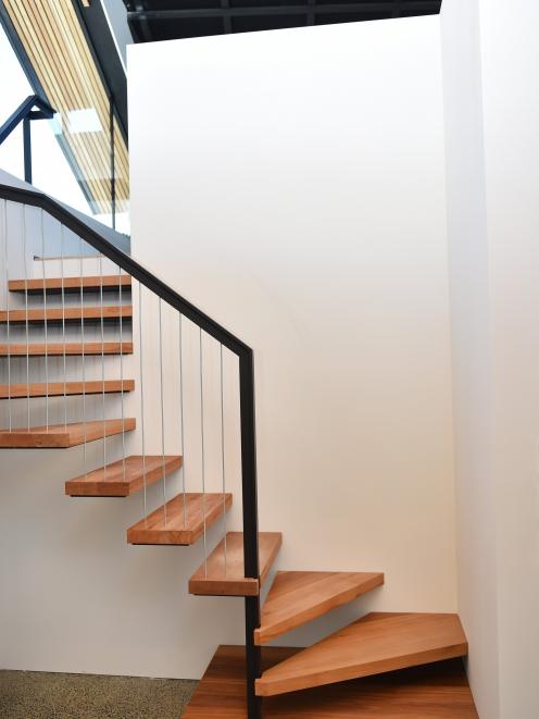 Kauri salvaged from the fire-damaged Bracken Court was used in the floating staircase.