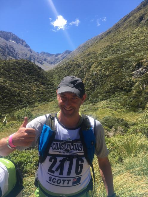 Scott Weatherall at the  top of  Goat Pass on the Coast to Coast on day 1. Photo: supplied

