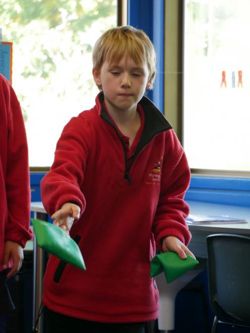 Mornington School pupil Lachlan Gascoyne (9) throws a bean bag during a game in the school’s Play...