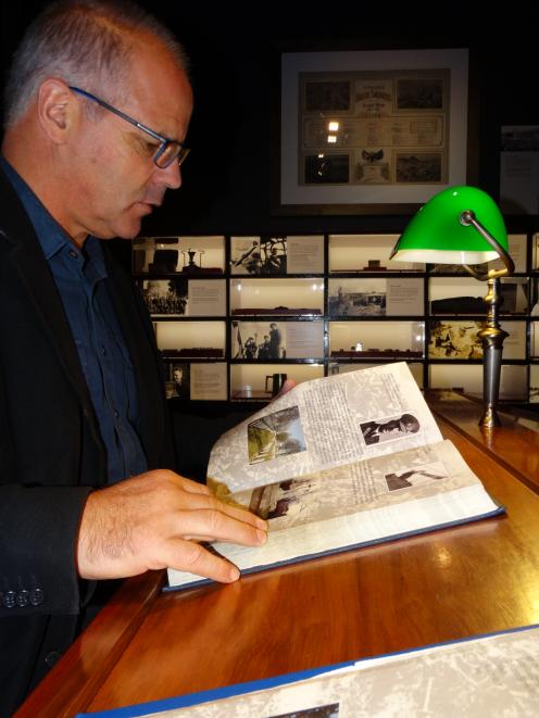 Toitu Otago Settlers Museum curator Sean Brosnahan looks over biographies of Otago soldiers who...