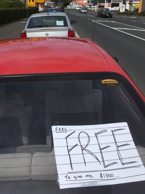 A line of cars for private sale in Kaikorai Valley Rd. PHOTO: SHAWN MCAVINUE
