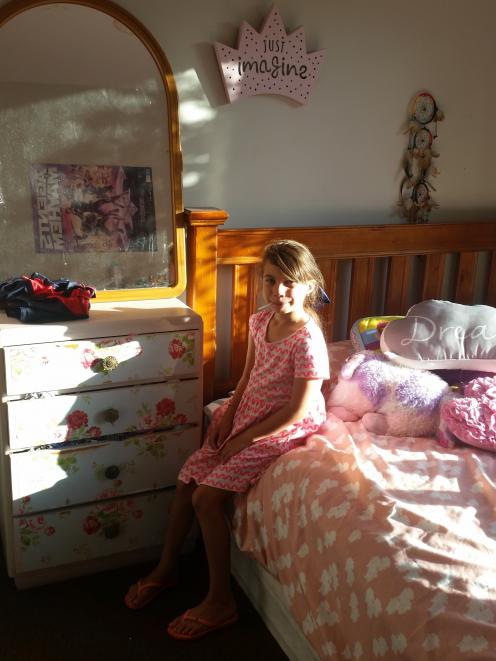 Ariah  in her bedroom before it received a makeover by Make-A-Wish.  PHOTO: SUPPLIED






