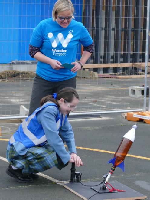 St Hilda’s Collegiate year 8 pupil Izzy Taylor prepares to set of a mini-rocket, with the help of...