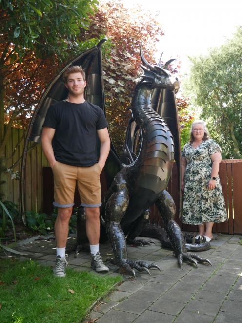 Steel sculptor Bryce Neaves, of Dunedin, stands with the dragon he created for Outram couple...