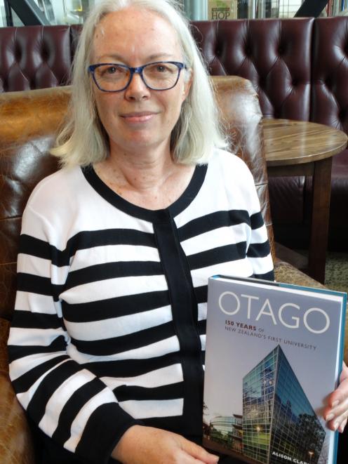 Historian and University of Otago graduate Dr Ali Clarke with her themed history of the...