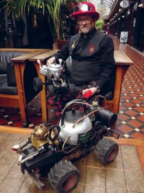 Pot builder and racer David Sawyer with two of the radio-controlled monsterpots he has created....