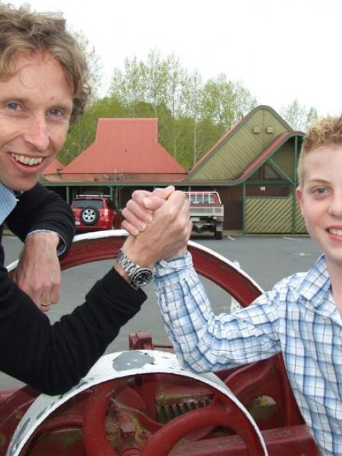 2004 Olympic triathlon gold medallist Hamish Carter arm-wrestles with South Otago athlete Reilly...