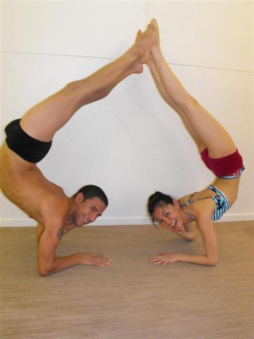 2011 International Ghosh Cup yoga champions Joseph Encinia and Yukari Miwa took classes at...