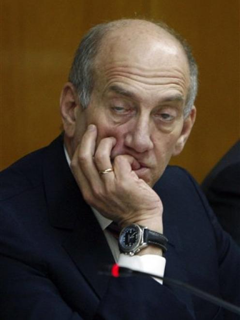 Israeli Prime Minister Ehud Olmert listens during a committee meeting at the Knesset, Israel's...