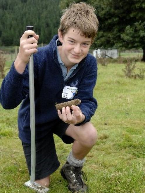 Taieri College pupil Alex Keith (14) takes soil samples as part of the science section of the...
