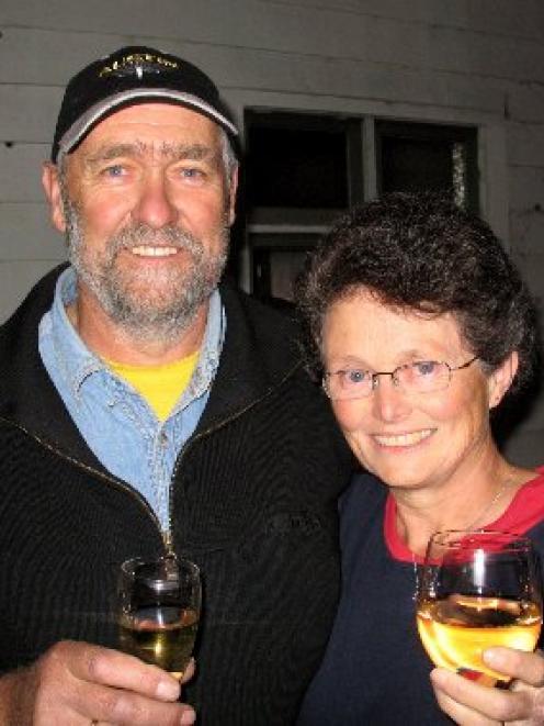 Brian and Penny Anderson, celebrate after buying Waikouaiti's old school house last night. Photo...